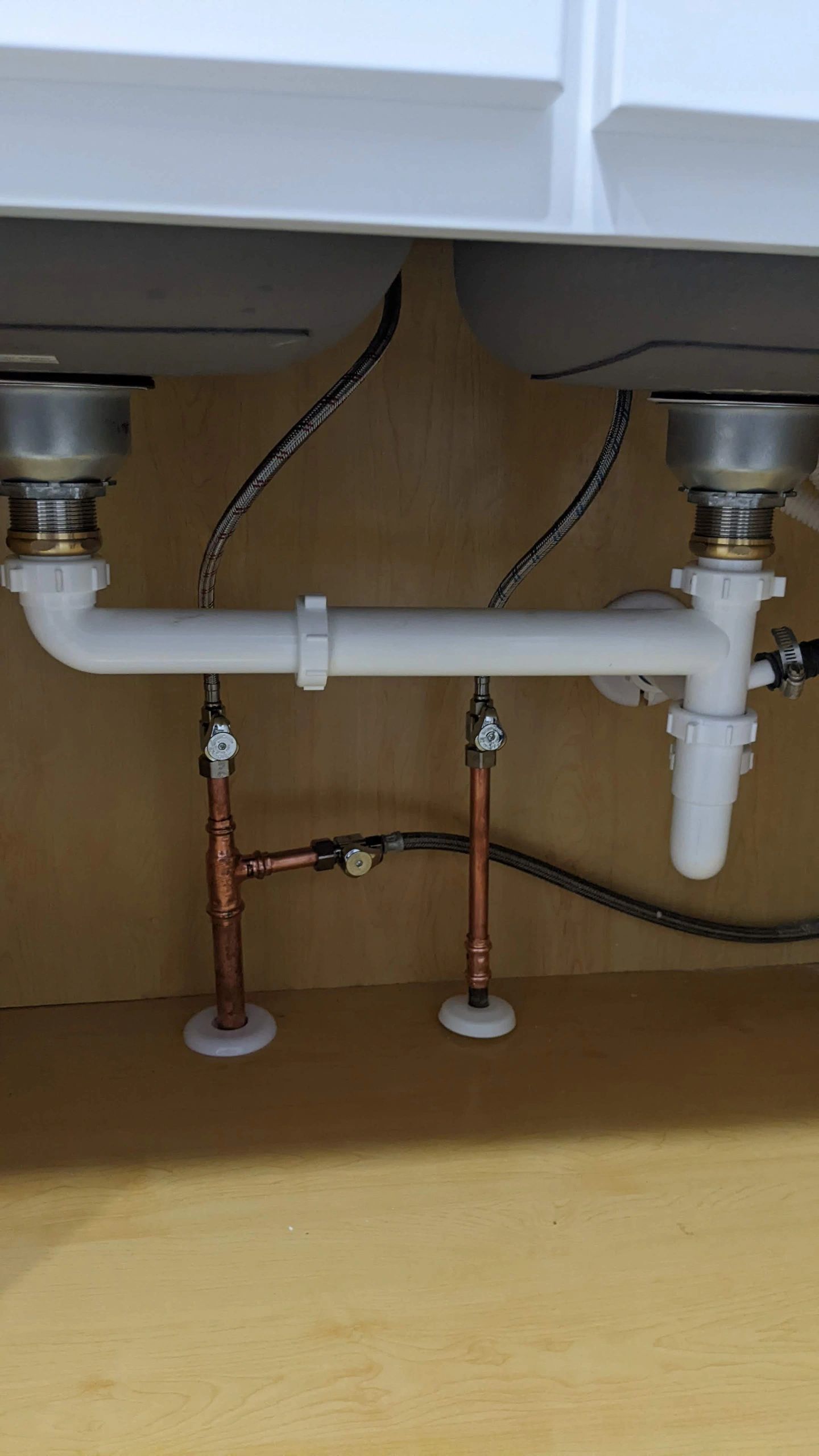 Under-sink plumbing repair by Essential Plumbing